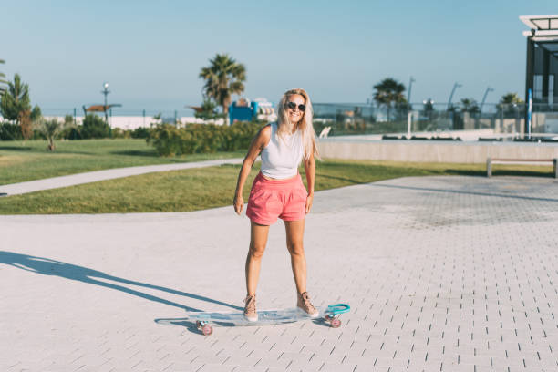 istock A beautiful skate woman rides her longboard. 1514308314