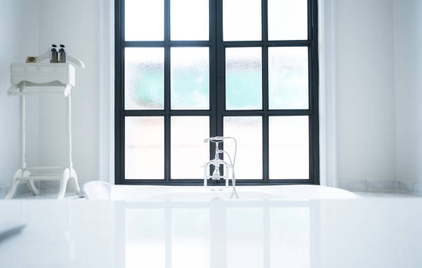istock Bathroom faucet and sink in modern bathroom with sunlight 1514345647
