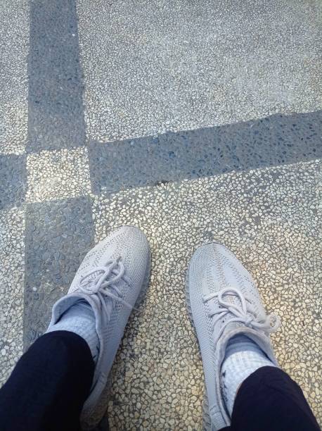 istock Pair of White Lace up Sneakers 1514348829