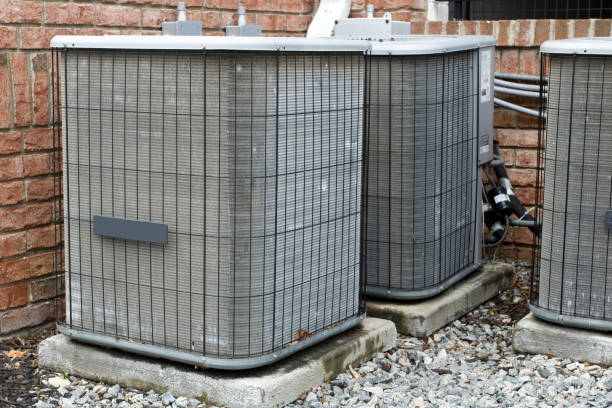 istock Air Conditioning units on side of brick building 1514381756