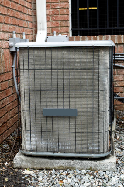 istock Air Conditioning unit on side of brick building 1514381757