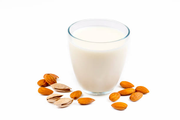 istock Almonds and almond milk on the white background 1514390894