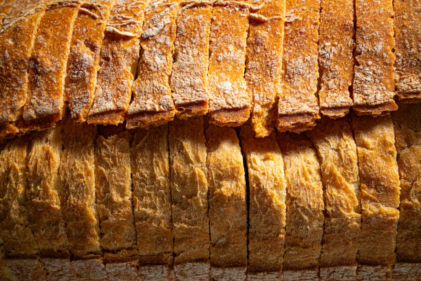 istock Bread loaf sliced texture slices detail flat lay 1514405878