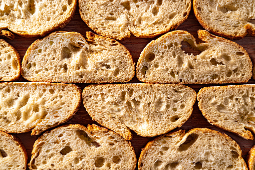 Bread slices in a row macro detail texture flatlay high angle view background