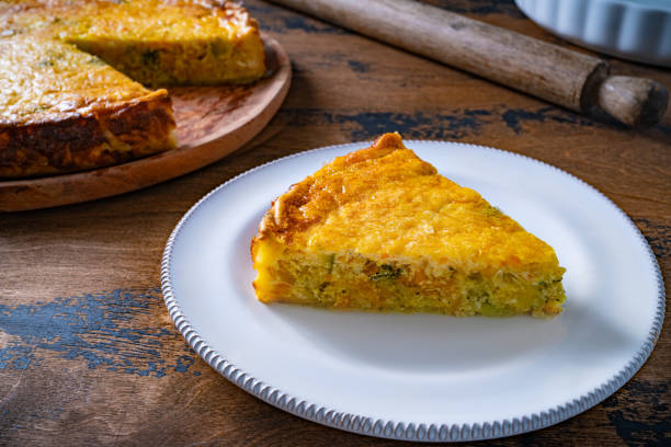 istock Vegetables quiche slice on plate homemade on wooden rustic table 1514409074
