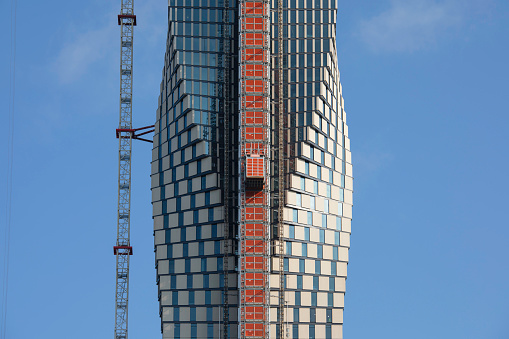 Construction elevator on the facade of Karlatornet (Karla Tower) in Gothenburg, an apartment skyscraper under construction. When finalized it will be 246 metres tall and the tallest building in the Nordic countries.