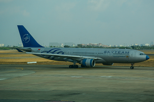 Saigon, Vietnam - Apr 13, 2016. An Airbus A330-200 airplane of Vietnam Airlines (SkyTeam Livery) taxiing on runway of Tan Son Nhat Airport (SGN).