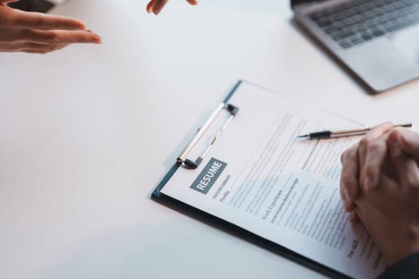 istock Graduates fill out the human Resources department application form and prepare personal document detailed study and interview notes and self-introduction. Job Application and Resume concept. 1514489352