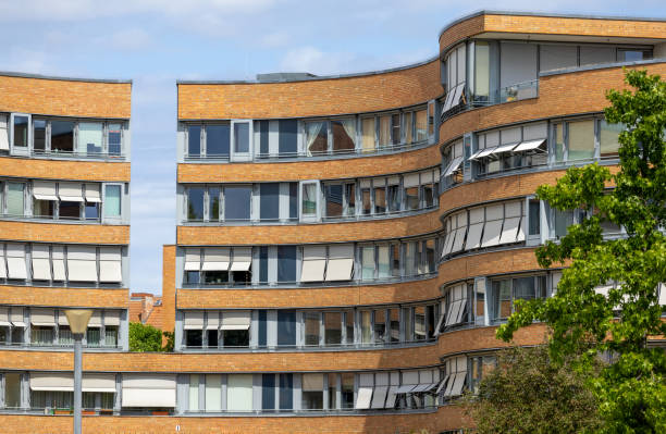 Berlin, Germany.  The apartment building complex in Moabit Werder district Berlin, Germany. View from the Spree River of The Snake or Federal Snake Complex, an apartment building complex in the Moabit Werder district moabit stock pictures, royalty-free photos & images