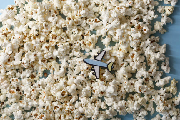 istock A toy plane on a purple background popcorn clouds 1514576375