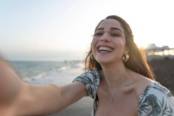 istock Woman taking selfie on the beach. 1514597761