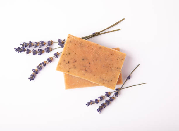 istock Natural soap with lavender extract. Handmade soap with lavender flowers isolated on white background. spa and relaxation concept.Aromatherapy.Flat lay.Place for text.Place for copy. 1514652235