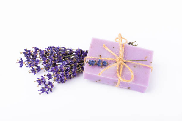 istock Natural soap with lavender extract. Handmade soap with lavender flowers isolated on white background. spa and relaxation concept.Aromatherapy.Flat lay.Place for text.Place for copy. 1514652920