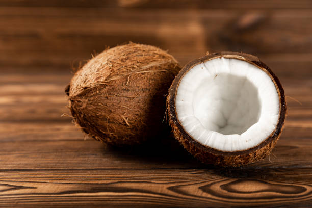 istock Coconuts on a wooden background. Close-up. 1514684590