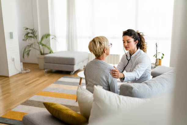istock Attractive young female doctor checking senior patient with stethoscope 1514688328