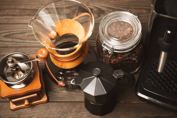 istock Preparing coffee using Chemex, pour coffee maker and drip kettle. Alternative ways to brew coffee.Coffee shop concept.Creamy latte with cream. Vanilla raf. 1514709583