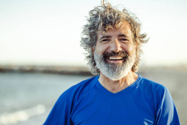 istock Satisfied senior man thinking at beach 1514718742