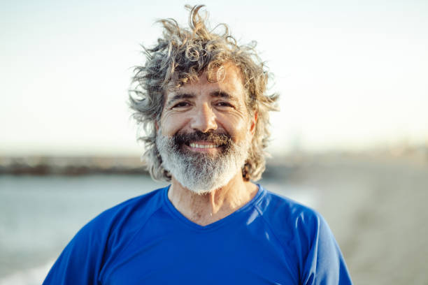 istock Satisfied senior man thinking at beach 1514719213