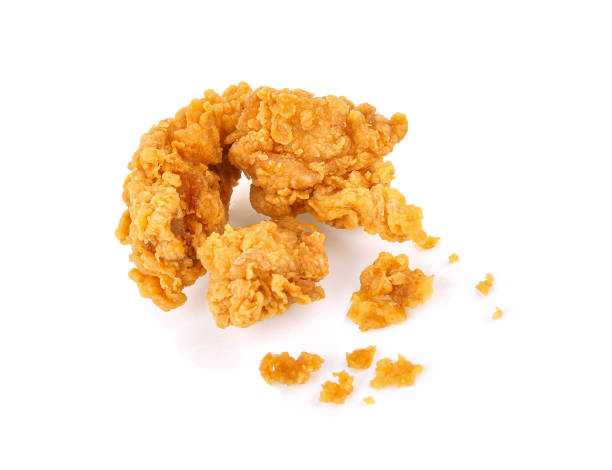 istock Fried popcorn chicken with crumbs isolated on white 1514729881