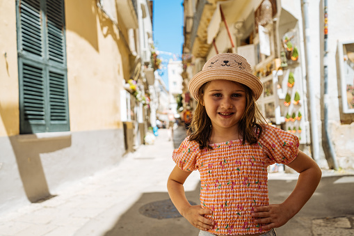 Young girl in the old town in Italy