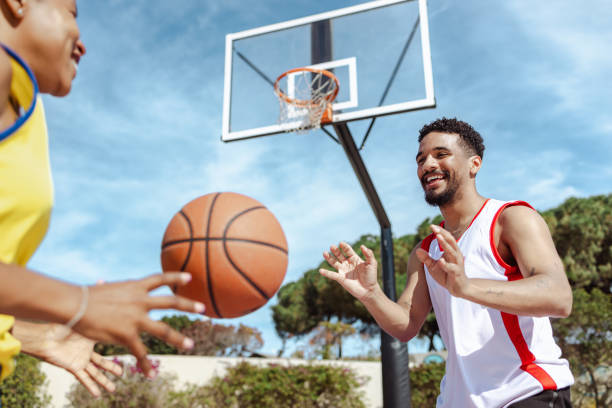 istock Cheerful friends playing street basket 1514808034
