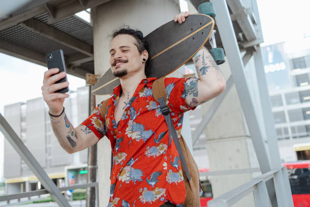 istock Latin American man is looking at his smart phone while walking through the city 1514821733
