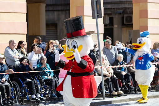 Piove di Sacco, Veneto, Italy - Mar 26th, 2023: Disney Characters (Scrooge McDuck and Donald Duck) during a carnival parade