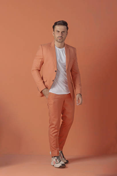 istock Male model posing in orange suit 1514823824