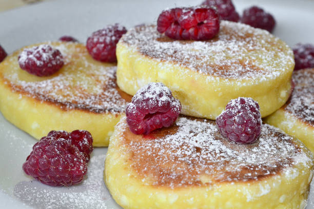 istock fried cottage cheese pancakes sprinkled with fresh raspberries 1514879387