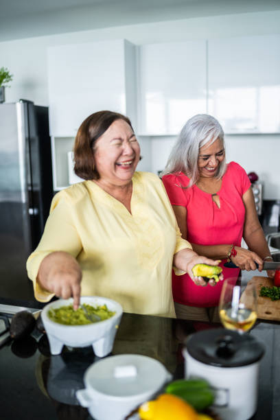 istock Mature women preparing guacamole at a domestic kitchen 1514879392