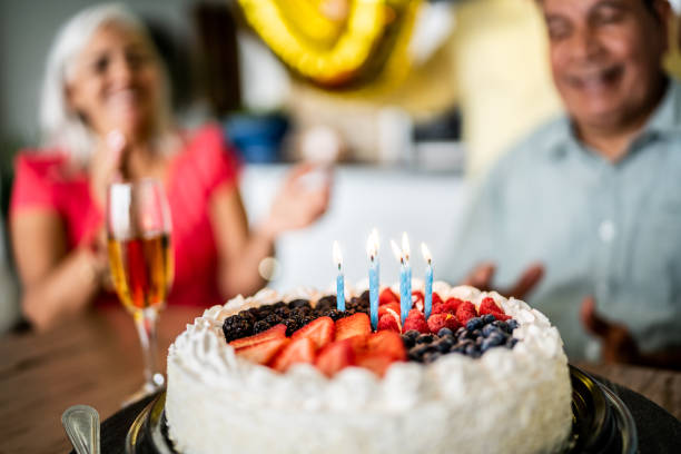 istock Birthday cake with ignited candles at home 1514906545