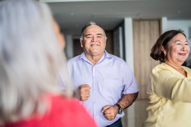 istock Senior friends dancing and having fun at home 1514907580