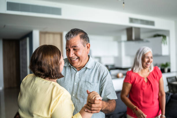 istock Senior couple dancing close together at home 1514907601