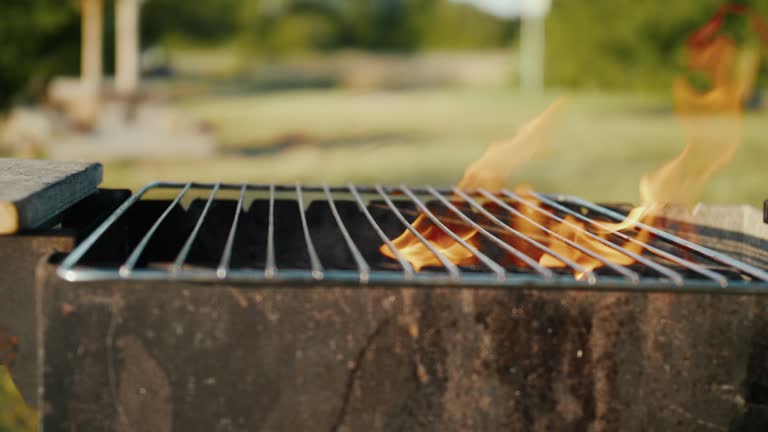 With the fire roaring inside, the grill grate is set on the barbecue, ready for cooking