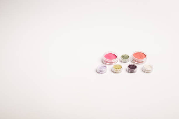 Many colorful natural mineral eyeshadows isolated on white