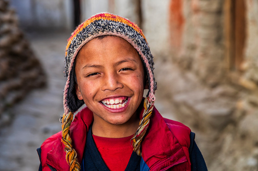 A young Tibetan Buddhist monk, Lo Manthang in Upper Mustang. Mustang region is the former Kingdom of Lo and now part of Nepal,  in the north-central part of that country, bordering the People's Republic of China on the Tibetan plateau between the Nepalese provinces of Dolpo and Manang.