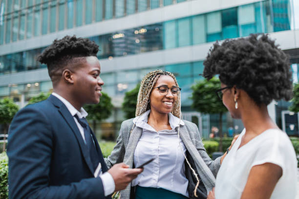 istock Young adult black colleagues taking break outdoors during working day 1515012097