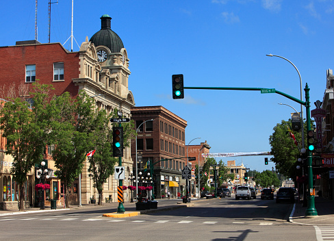 Corner of High Street and Main Street  Historic downtown Moose Jaw.  Large building on the left is City Hall which is a designated Heritage building. Architecture is Edwardian Classical. Completed in 1914.