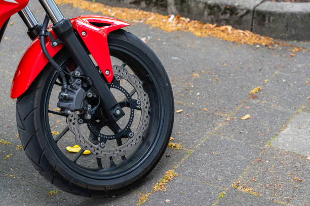 istock Front wheel of a red motorcycle with disc brakes. 1515021470