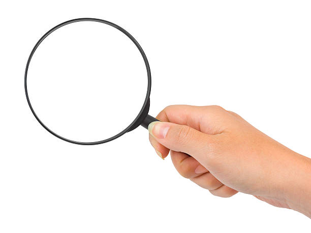 istock Person holding onto a magnifying glass 151509652