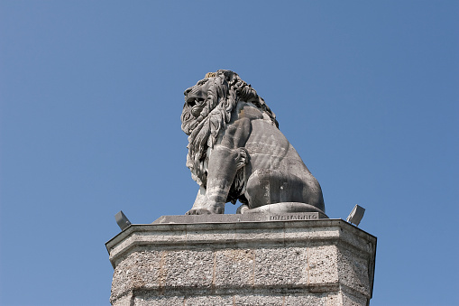A lion statue is guarding the harbour of the German city of Lindau in the Bodensee