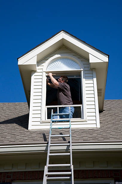 istock Painter painting trim around doors windows 151512266