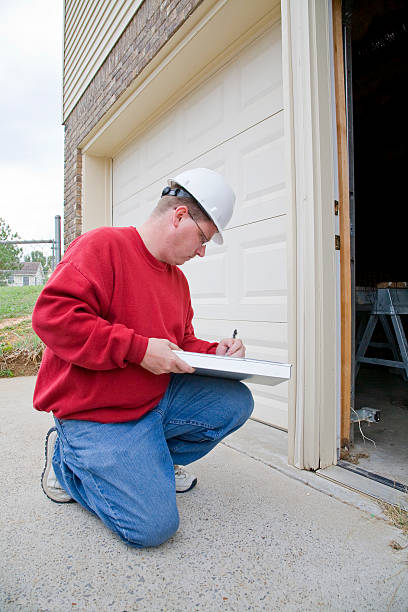 istock Man kneeling inspecting a home 151512277
