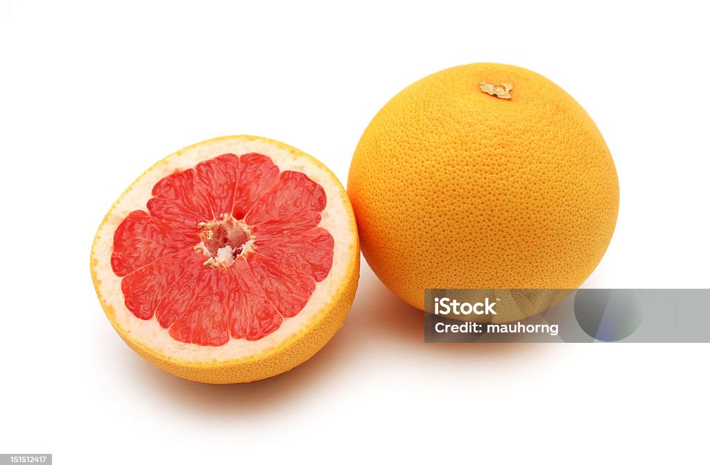 Grapefruit Close up of one and half grapefruits isolated on white background. Circle Stock Photo