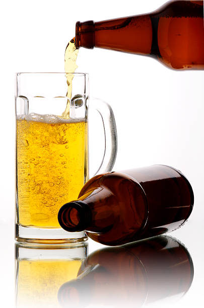 Two bottles and glass with beer stock photo