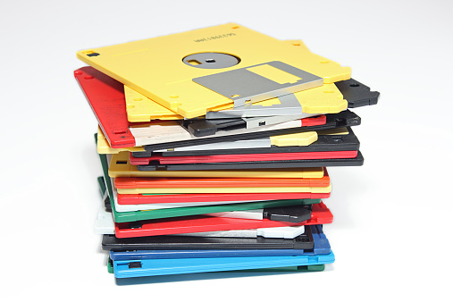 Muchos colores computar disquete Aislado en blanco photo