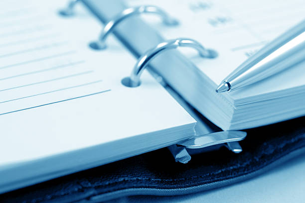istock Close up of note and pen (blue toned) 151513343