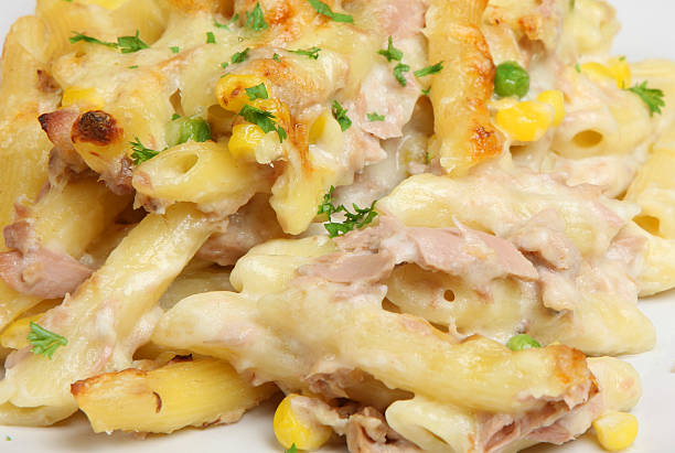 Tuna Pasta Bake Rigatoni pasta baked with tuna in cheese sauce pasta casserole stock pictures, royalty-free photos & images