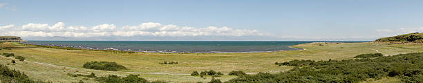 Panorama of a coastal line lake Sevan stock photo