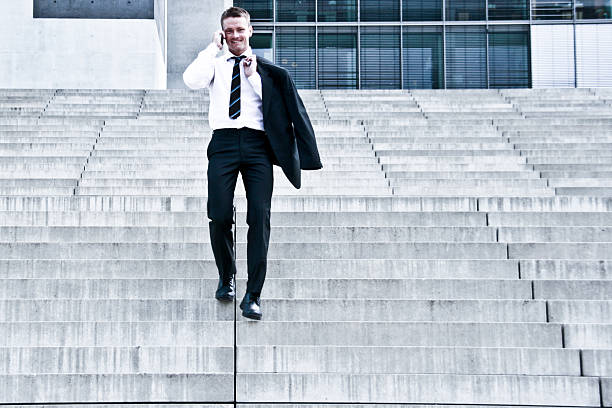istock Corporate Man With Cellular Phone On Stairs 151513829